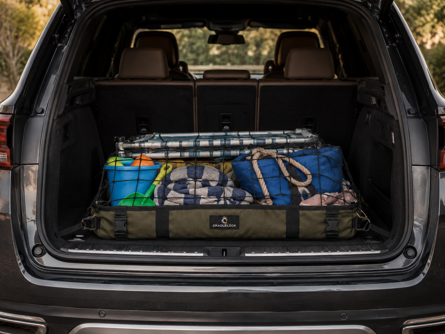 Beach towels, chairs, toys, and sandy gear contained in CradleLock inside an SUV
